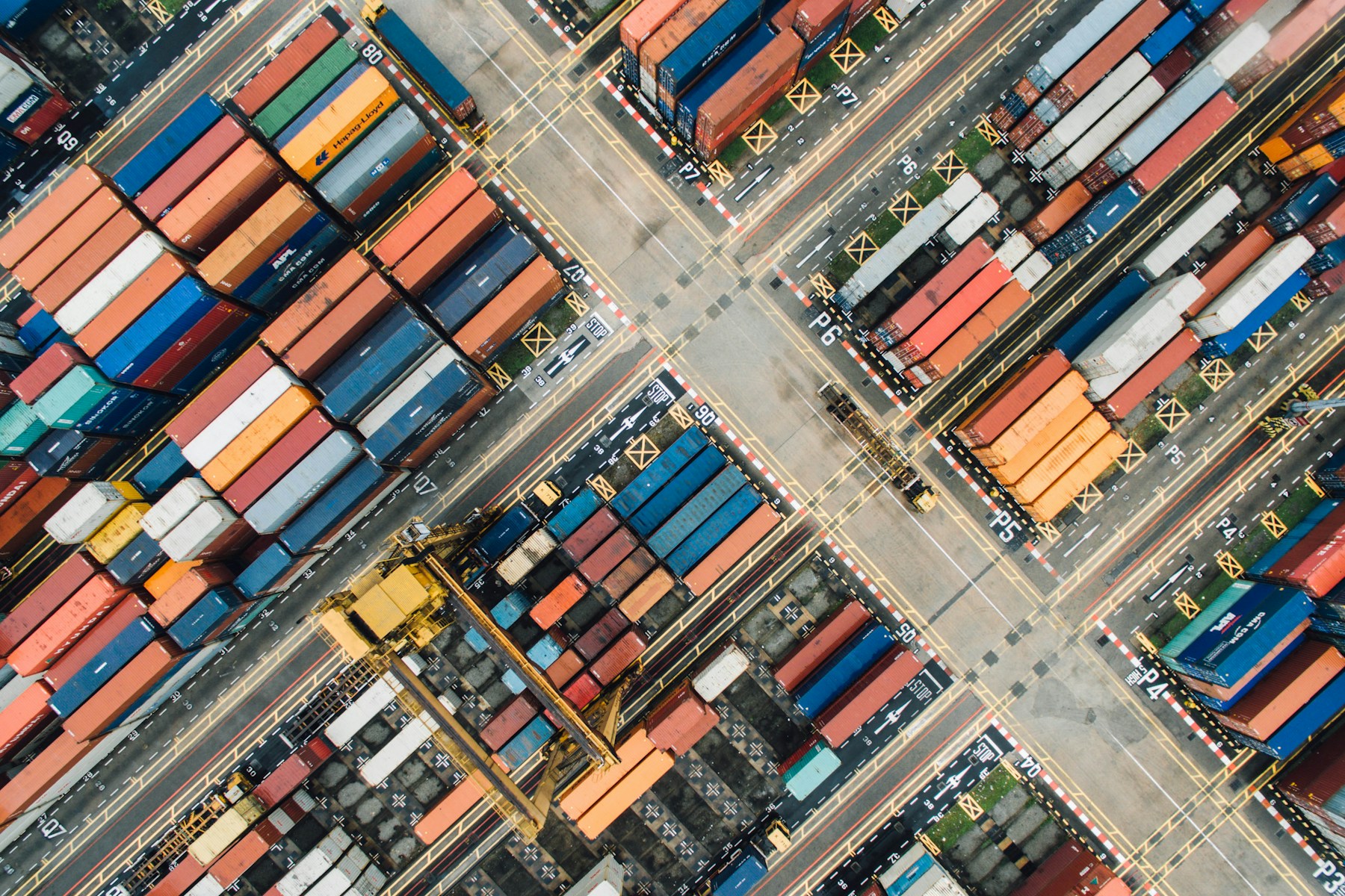 An aerial view of colourful shipping containers at a cargo terminal