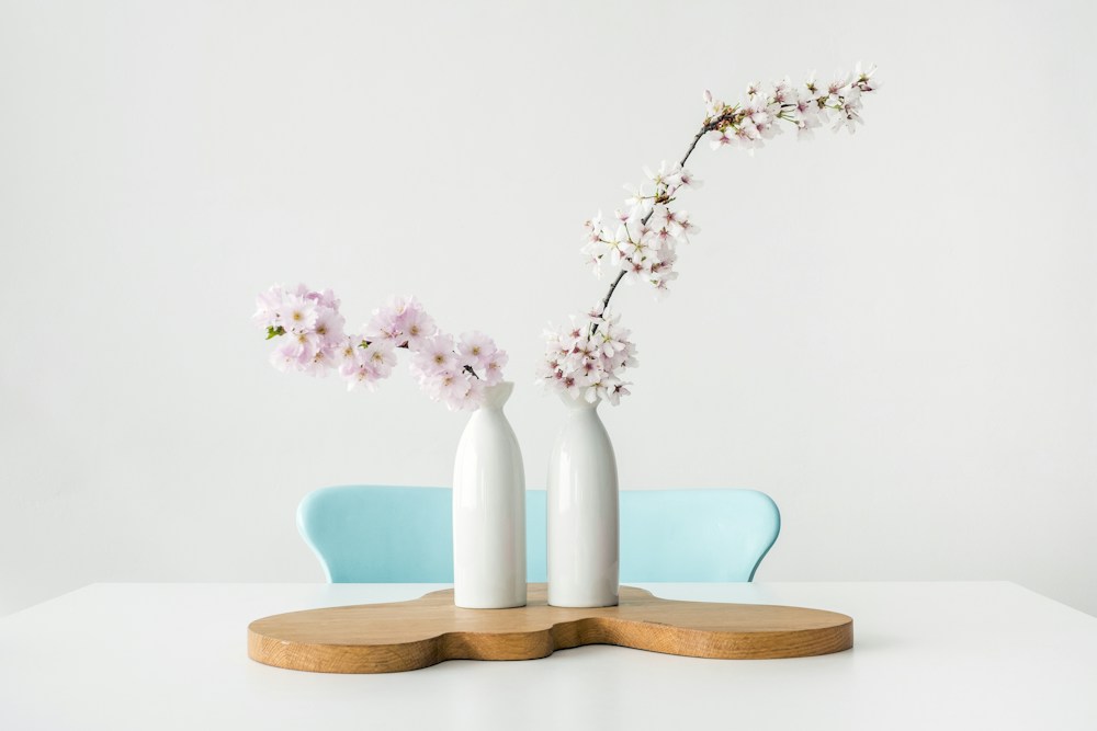 Ceramic vases and wooden home accessories on a table